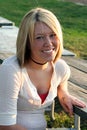 Smiling Blond Woman At Outdoor Table 2 Royalty Free Stock Photo