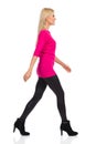 Smiling Blond Woman Is Walking. Side View. Isolated On White Royalty Free Stock Photo