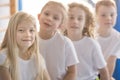 Smiling blonde girl with friends