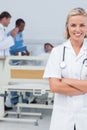 Smiling blonde nurse crossing her arms Royalty Free Stock Photo