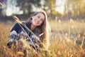 Smiling blue eyes girl in a field