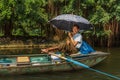 A smiling boat guide at Trang An UNESCO World Heritage site in N