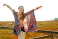 Smiling bohemian girl outdoors in summer evening rejoicing Royalty Free Stock Photo