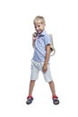 A smiling boy with a backpack is standing. Back to school. Isolated on white background. Vertical Royalty Free Stock Photo