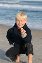 Smiling Boy at Beach shows Shell Royalty Free Stock Photo