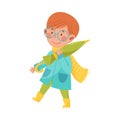 Smiling Boy Character in Rubber Boots and Raincoat Walking and Carrying Umbrella Vector Illustration Royalty Free Stock Photo