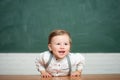 Smiling boy in classroom. School. Little cute boy is smiling. Charming boy in shirt. International childrens day Royalty Free Stock Photo