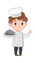 Smiling boy in cook uniform with dish