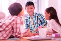 Smiling boy drawing with his friends in class. Royalty Free Stock Photo