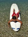 Smiling boy enjoy on surfing desk on sea Royalty Free Stock Photo