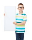 Smiling boy in eyeglasses with white blank board Royalty Free Stock Photo