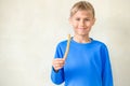 Smiling boy with famous Spanish dessert churros