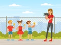 Smiling Boy and Girl with Golden Medal Posing for Female Taking Photograph with Camera Vector Illustration