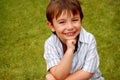 Smiling boy on grass Royalty Free Stock Photo