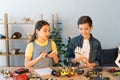 smiling boy holding robotics hand near