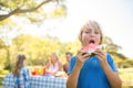 Smiling boy holding watermelon in the park Royalty Free Stock Photo