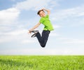 Smiling boy jumping in air Royalty Free Stock Photo