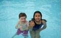 Smiling boy and little girl swimming Royalty Free Stock Photo