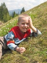 Smiling boy lying on grass Royalty Free Stock Photo