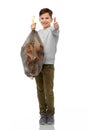 smiling boy with paper garbage in plastic bag