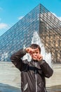 Smiling boy in Paris near the Louvre pyramid Royalty Free Stock Photo