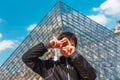 Smiling boy in Paris near the Louvre pyramid Royalty Free Stock Photo