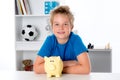 Smiling boy with piggy-bank Royalty Free Stock Photo