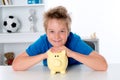 Smiling boy with piggy-bank Royalty Free Stock Photo