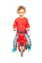 Smiling boy with plastic bike