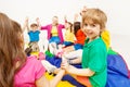 Smiling boy playing circle games with friends Royalty Free Stock Photo