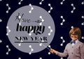 Smiling boy pointing with stick at new year greeting quotes Royalty Free Stock Photo