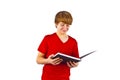 Smiling boy is reading in a book Royalty Free Stock Photo