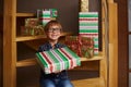 Smiling boy ready to open Christmas presents Royalty Free Stock Photo