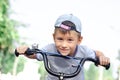 Smiling boy riding bicycle