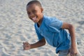 smiling boy running with sand Royalty Free Stock Photo