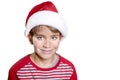 Smiling boy in Santa red hat isolated on white background. Christmas concept. Royalty Free Stock Photo