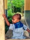 Portrait of a happy Papuan boy playing in the schoolyard Royalty Free Stock Photo