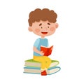 Smiling Boy Sitting on Pile of Books and Reading Vector Illustration Royalty Free Stock Photo