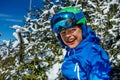 Smiling boy in ski helmet and snowy background Royalty Free Stock Photo