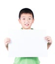 Smiling boy standing with empty horizontal blank paper in hands isolated on white background