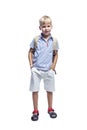 Smiling boy stands with a backpack. Full height. Back to school. Isolated on white background. Vertical Royalty Free Stock Photo