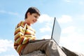 Smiling boy studies outside Royalty Free Stock Photo