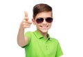 Smiling boy in sunglasses and green polo t-shirt Royalty Free Stock Photo