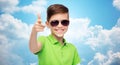 Smiling boy in sunglasses and green polo t-shirt Royalty Free Stock Photo