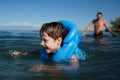 Smiling boy swimming Royalty Free Stock Photo