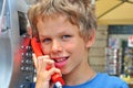 Smiling boy talking by phone Royalty Free Stock Photo
