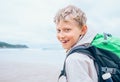 Smiling boy traveler portrait on ocean coast Royalty Free Stock Photo