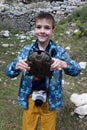 Smiling boy with turtle in his hands Royalty Free Stock Photo