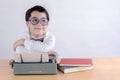 Smiling boy with typewriter Royalty Free Stock Photo