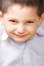 Smiling boy in white shirt